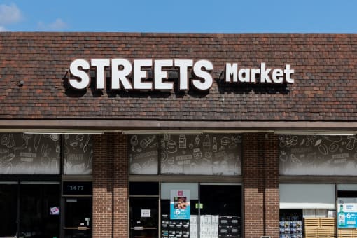 a streets market sign on the front of a brick building
