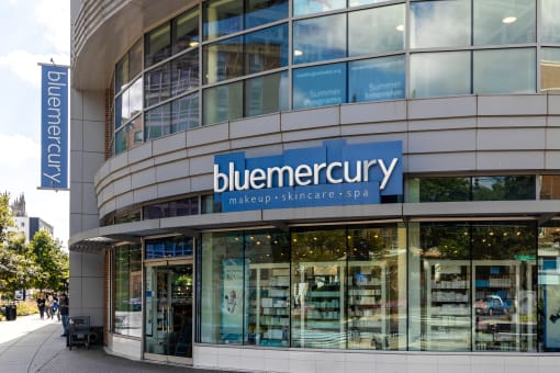 the facade of a building with a blueemedurgy sign on the side of it
