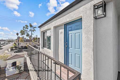 A blue door is on the front of a house.