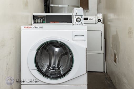 A washing machine with a digital display on top of it.