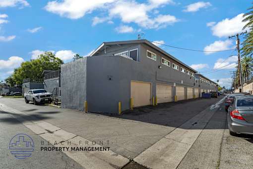 A building with the words "Beach Front Property Management" on the bottom left corner.