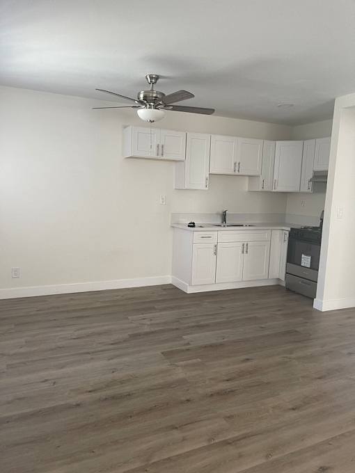an overhead view of a living room with white walls and wooden floors