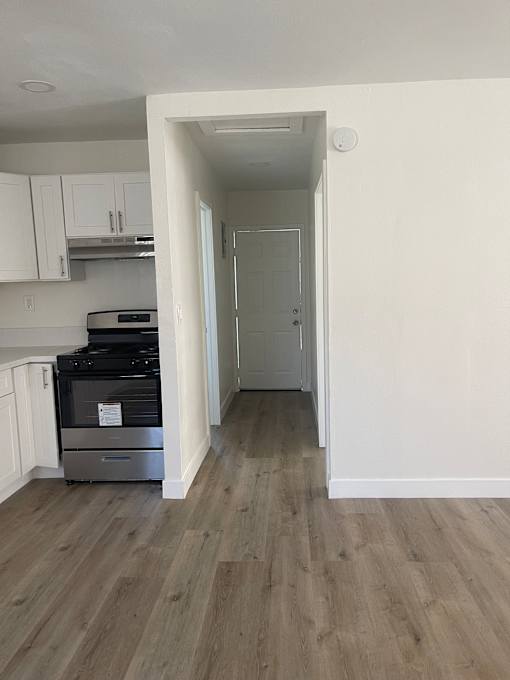 a small kitchen and refrigerator