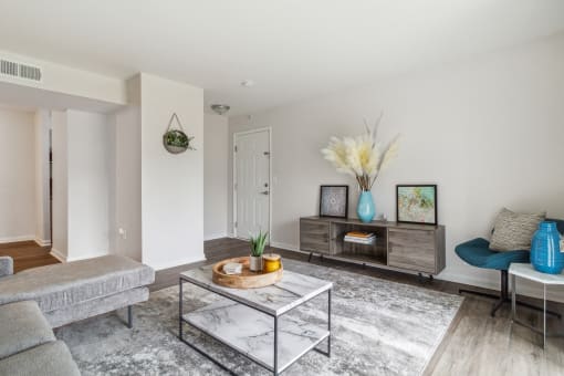 a living room with couches and a coffee table