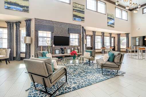 A living room with a fireplace and a television.