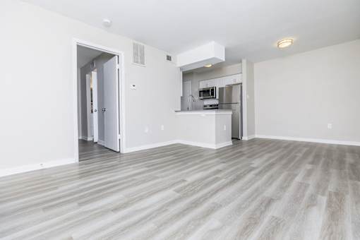 A kitchen area with a refrigerator, microwave, and oven.