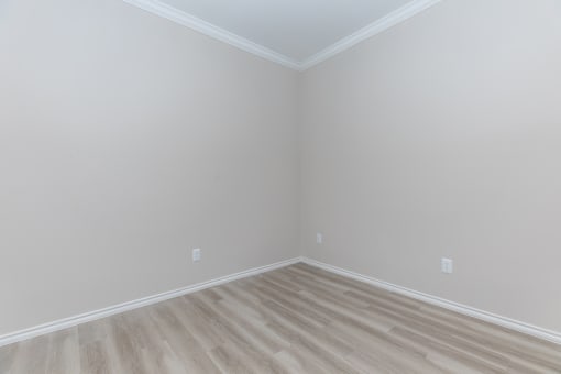a room with gray walls and a wooden floor