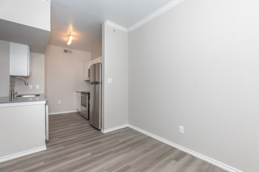 a kitchen and living room in a 555 waverly unit