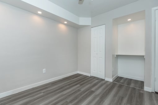 a living room with grey walls and a white door