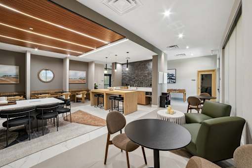 A modern dining area with a round table and chairs.