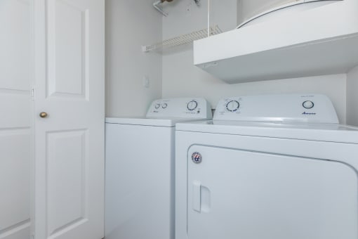 a laundry room with a washer and dryer