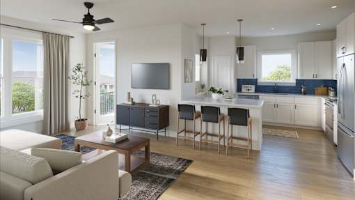 A modern kitchen with a bar area and a living room area.