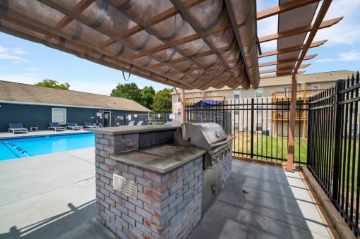 the preserve at ballantyne commons covered patio with grill and pool