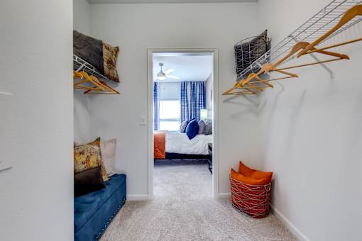 ?? bedroom with closet and closet hooks on the wall and a closet with a