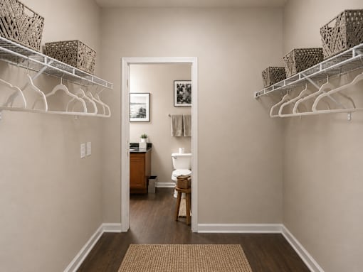 A room with a white wall and a brown rug.