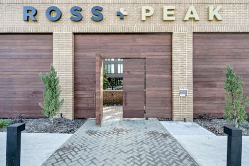 A building with a sign that says Ross + Peak.