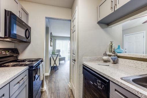 redesigned kitchen with granite countertops and stainless steel appliances at the preserve at great neck
