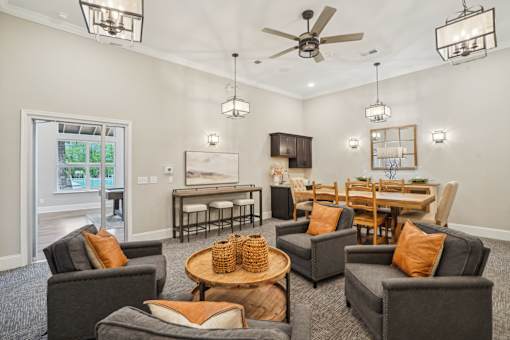 A living room with grey couches and a wooden coffee table.