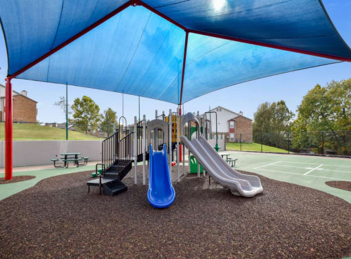 our playground is equipped with a variety of playground equipment including slides and swing sets