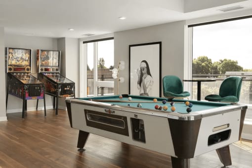 Game room with billiards and pinball machines