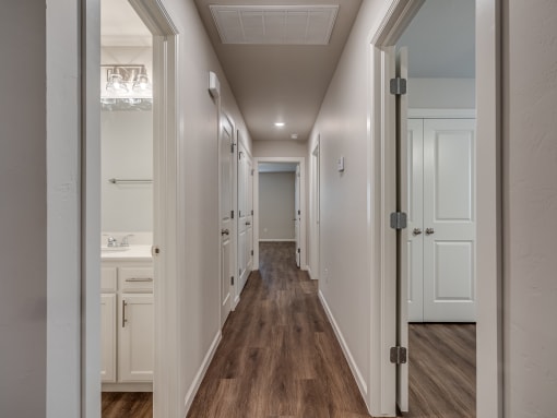 a bedroom with a medium sized bed and a mirror on the wall