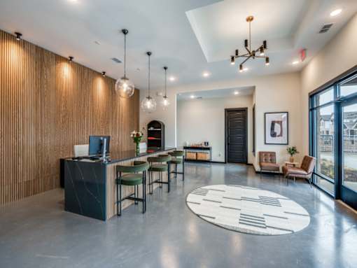 A modern office space with a reception desk and comfortable seating areas.