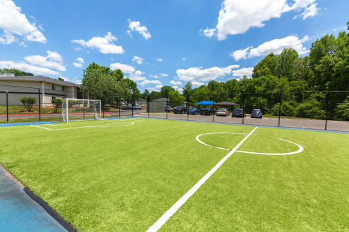 a soccer field at the whispering winds apartments in pearland, tx