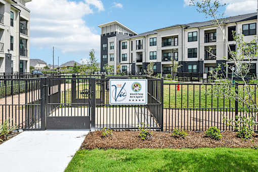 A black fence with a sign that says "Welcome to Westfield" in front of a building.