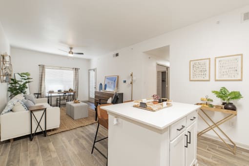 a living room with a kitchen and a dining room