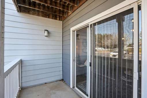 A white door with a glass window is open.