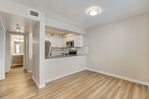 a kitchen and living room in a 555 waverly unit