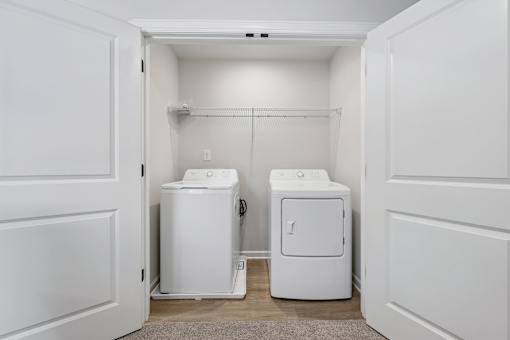 A laundry room with a washer and dryer.
