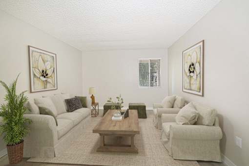 A living room with a couch, chairs, and a coffee table.