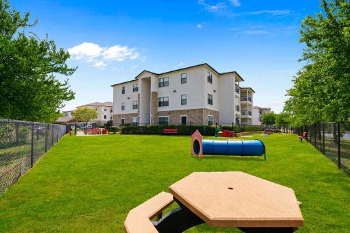 our apartments showcase a dog park with plenty of room to run and play