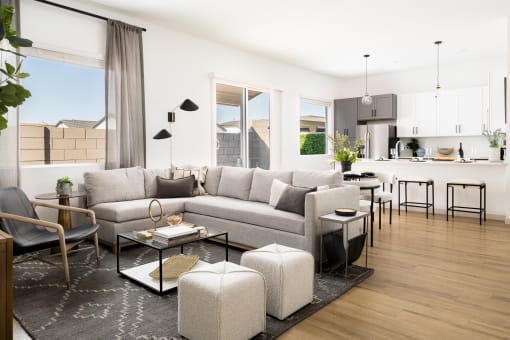 a rendering of a living room and kitchen in a model home