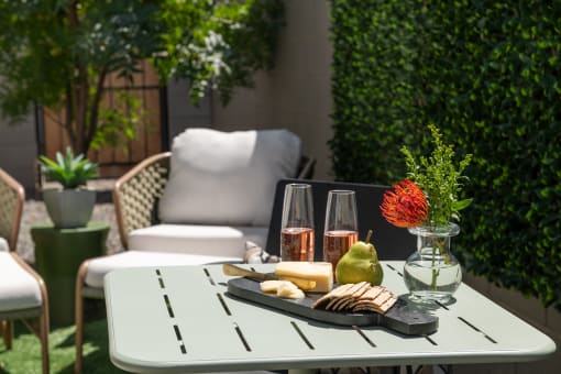 a table with a tray of food and drinks on a patio