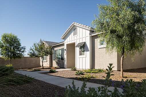 A modern house with a white door and windows.