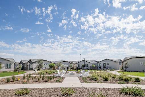 A row of houses with a walkway in the middle.