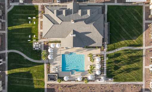 A large house with a pool in the backyard.