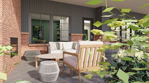 A modern outdoor seating area with a brick wall and greenery.