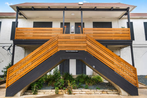 a building with a ramp with wooden benches