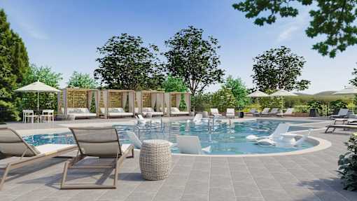 A large outdoor swimming pool surrounded by lounge chairs and umbrellas.