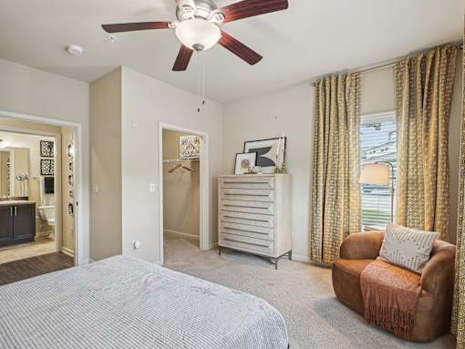 Modern apartment bedroom with large windows and contemporary finishes in Apex, NC