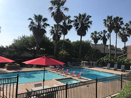 red umbrella near pool