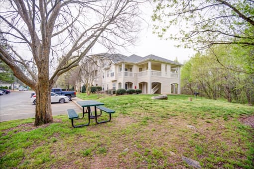 a house with a picnic table in front of it