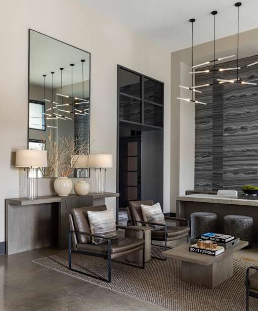 A modern living room with a grey and black color scheme.