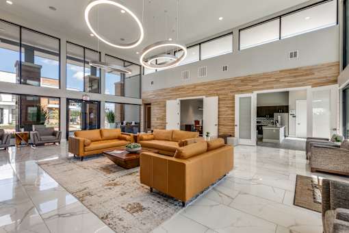 a large living room with couches and a rug