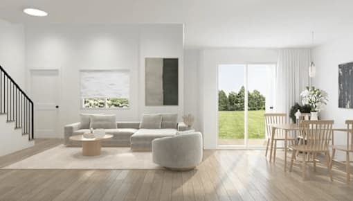 A modern living room with a white sofa set and a wooden coffee table.