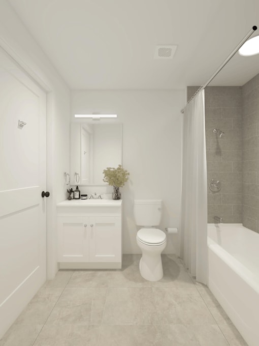 A white bathroom with a toilet, sink, and bathtub.