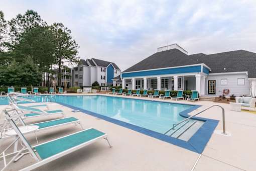 our apartments have a large swimming pool with chairs